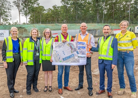 Gympie Mayor Glen Hartwig, Member for Gympie, Tony Perrett MP, Gympie Regional Council CEO Robert Jennings, and Council Staff at Bonnick Road Waste Management Facility holding draft plan of new Waste Transfer Station.jpg