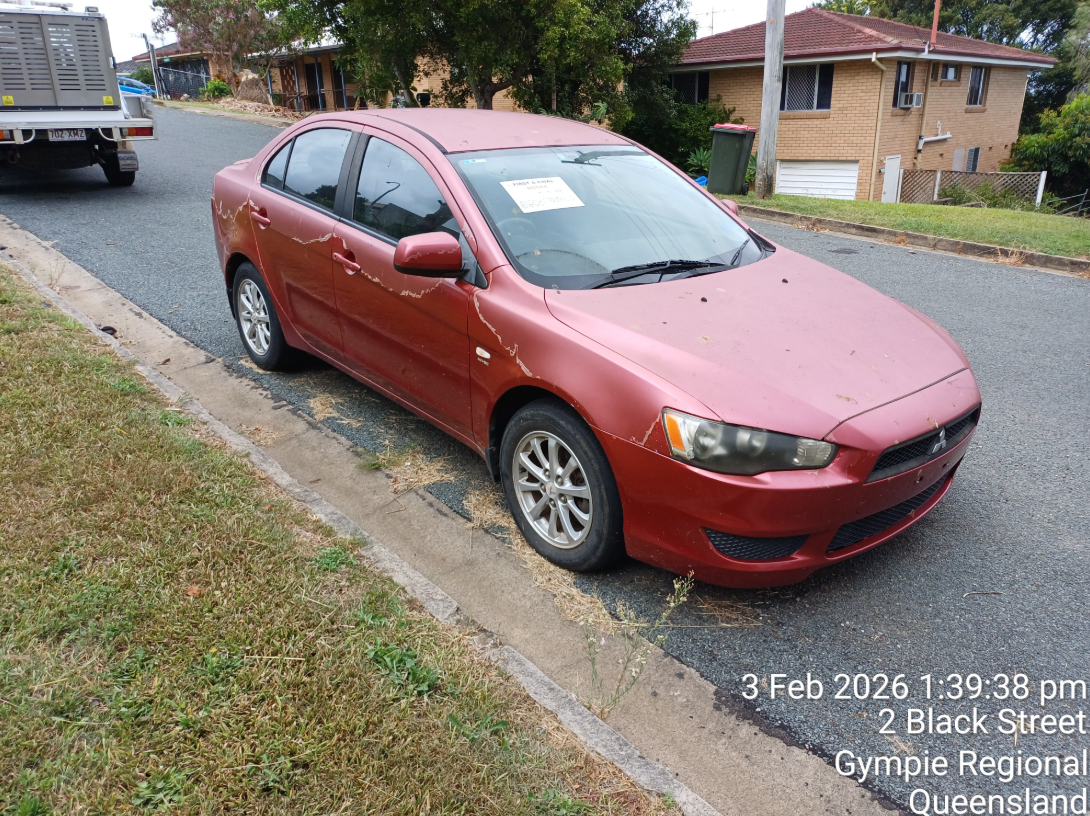 Red Misubishi Lancer.png